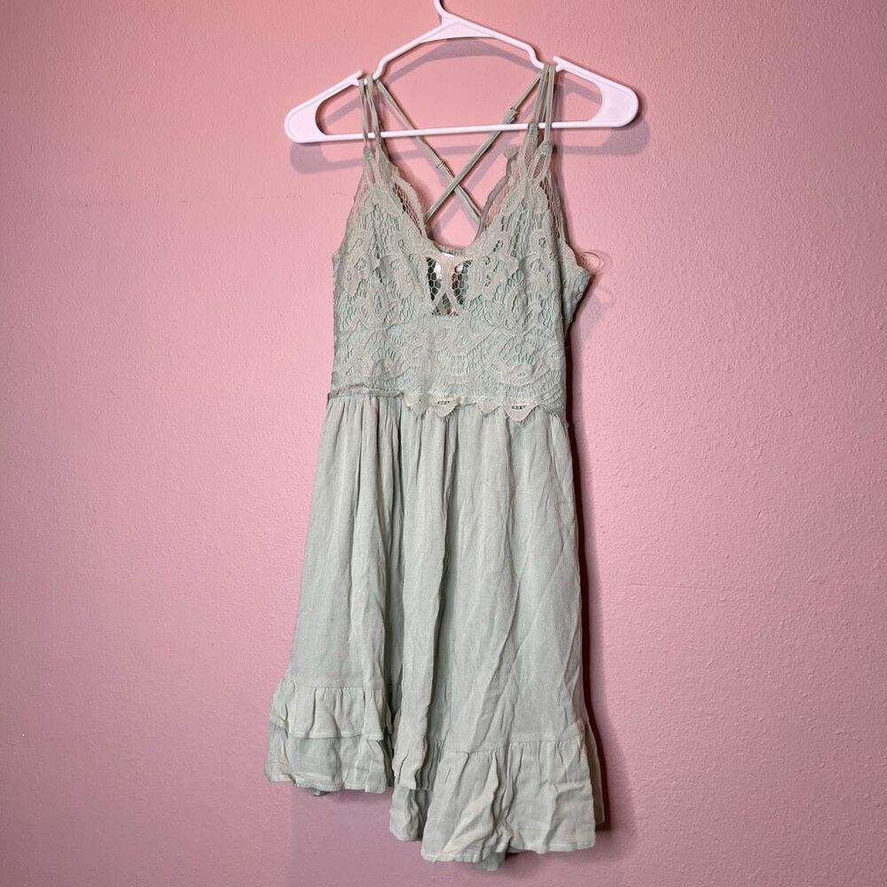Entro Crochet Lace Mini Dress in sage green, featuring a crinkle fabric ruffle t